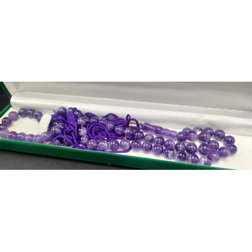 120 - Boxed set of chopsticks with silver elephant decoration and boxed amethyst worry beads