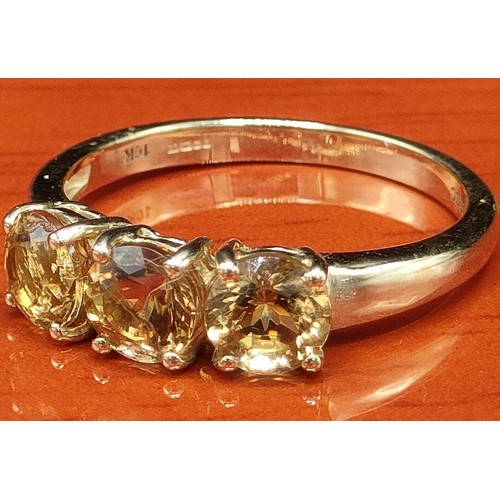 46 - 10ct yellow gold ring set with three pale yellow gem stones. [Ring size N] [2.38Grams]