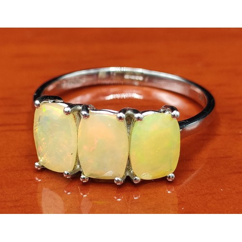 24 - 10ct white gold ladies ring set with three Ethiopian opal stones. [Ring size P] [2.16Grams]