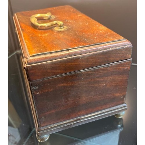 823 - 19th century mahogany lidded storage box, brass swing handle to lid and sat upon four brass bun feet... 