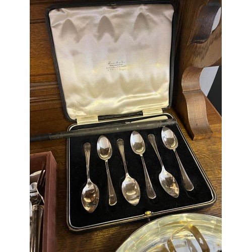 826 - A Selection of silver plated ware to include ornate candle sticks, serving tray, canteen of tea spoo... 