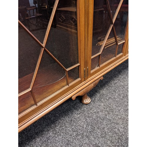 911 - Antique mahogany bookcase, four astragal glazed doors opening to interior storage shelving, raised o... 