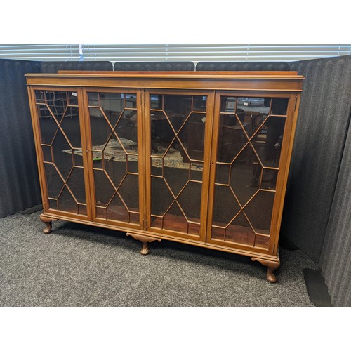 911 - Antique mahogany bookcase, four astragal glazed doors opening to interior storage shelving, raised o... 