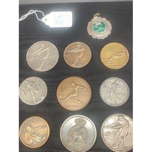 31A - A Collection of vintage sporting medallions for football and tug of war. Includes R.A.F Transport co... 