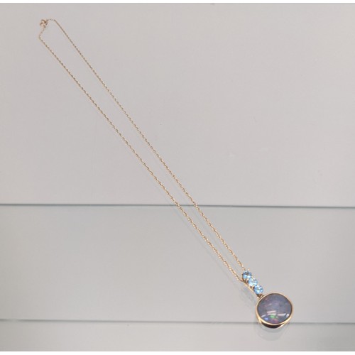 732 - 9ct yellow gold necklace with a 9ct gold, Large opal and three Aquamarine stone pendant. [3.33grams]