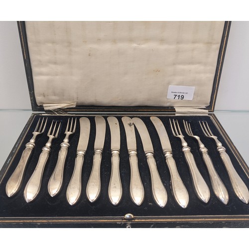 719 - Boxed set of Twelve Birmingham silver handle forks and butter knives.