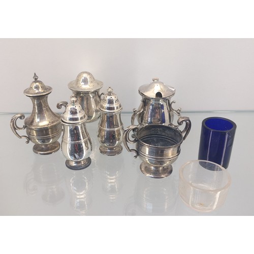 721 - A Collection of silver marked condiment pots, includes Glasgow silver art nouveau inspired pepper po... 