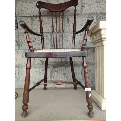 652 - A 19th century arm chair on turned supports