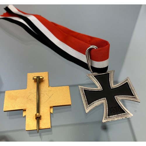 45A - Reproduction German WW2 Knights cross and one other enamel badge.