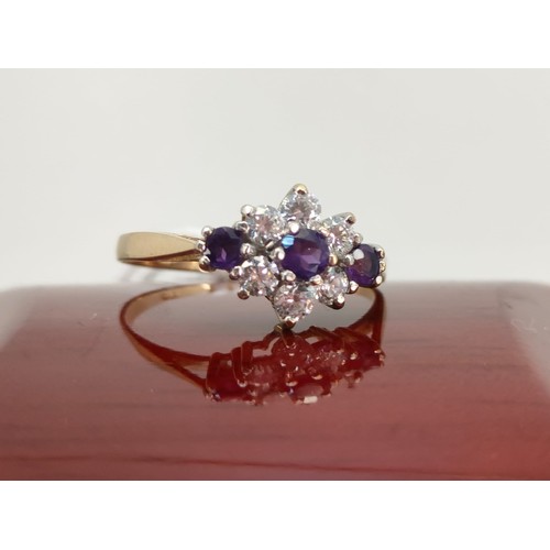 38A - 9ct yellow gold ladies ring set with Three Amethysts and 5 white CZ stones. [Ring size P] [1.81Grams... 