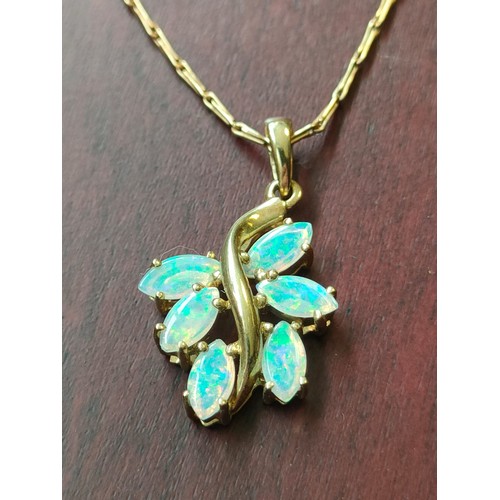 737 - A 9ct yellow gold necklace with a 9ct yellow gold and opal stone pendant. [3.86grams]