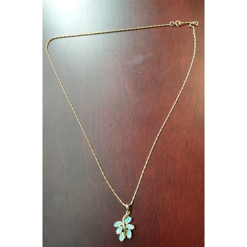 737 - A 9ct yellow gold necklace with a 9ct yellow gold and opal stone pendant. [3.86grams]