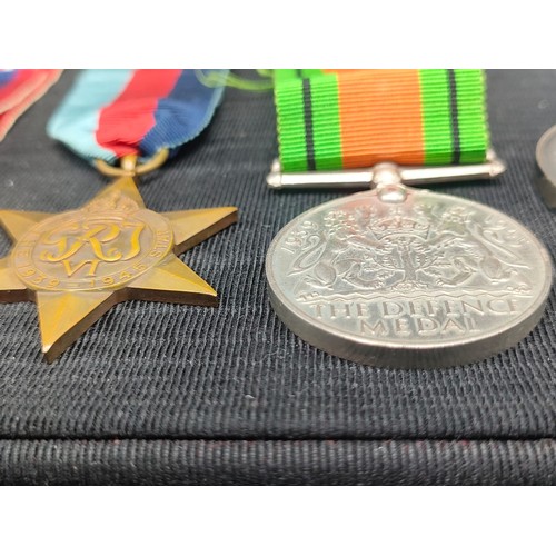 17 - Three WW2 Medals with ribbons and two vintage Amateur Gardening medallion coins.