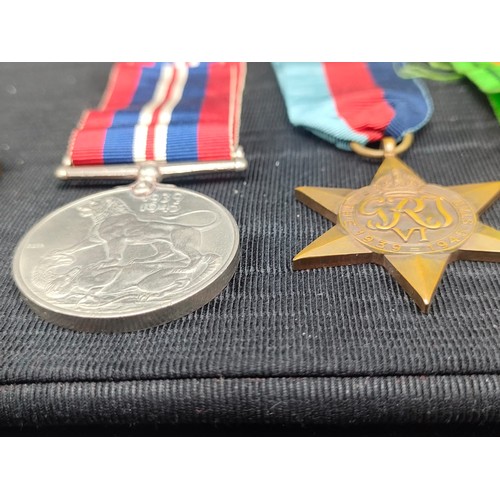 17 - Three WW2 Medals with ribbons and two vintage Amateur Gardening medallion coins.