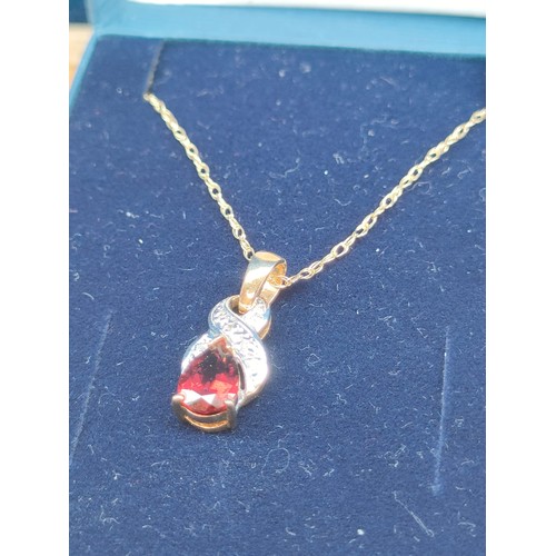 19A - 9ct yellow gold necklace with a 9ct yellow gold pendant set with a single pear shaped garnet and dia... 