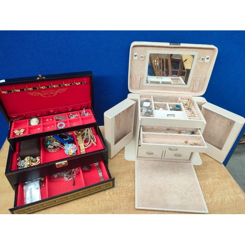 56A - Two jewellery boxes containing mixed costume jewellery, includes watches, earrings, necklaces and pe... 