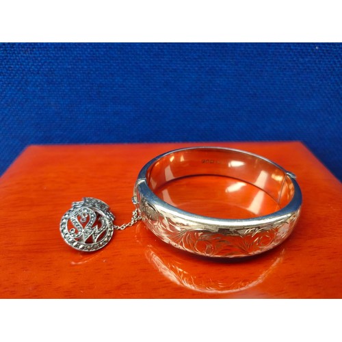 29A - Chester Silver ornate bangle with a gilt finish. Together with a London silver and marcasite stone b... 