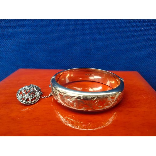 29A - Chester Silver ornate bangle with a gilt finish. Together with a London silver and marcasite stone b... 