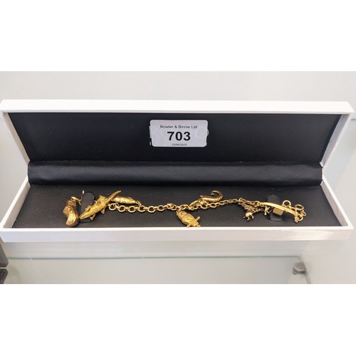 703 - 18ct yellow gold [750] charm bracelet with four 18ct yellow gold charms and three 9ct yellow gold ch... 