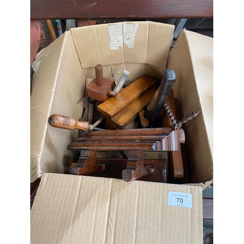 70 - A box of antique tools to include an F.D.E Sales J.C Jeffs wooden plane, hand drills and chisels