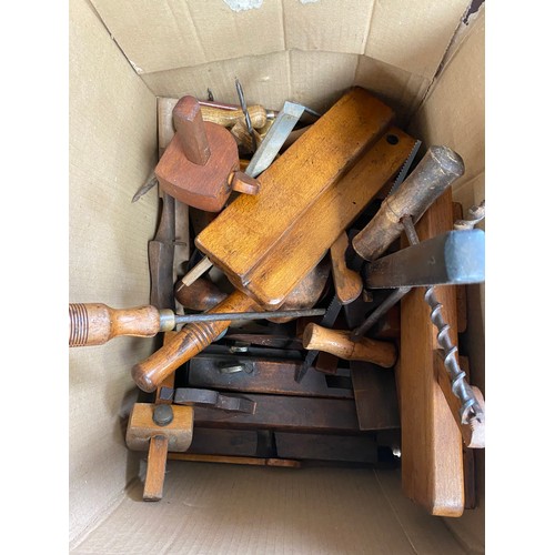 70 - A box of antique tools to include an F.D.E Sales J.C Jeffs wooden plane, hand drills and chisels