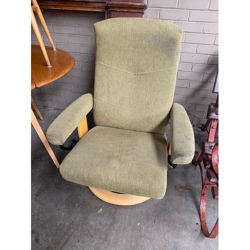 75 - Contemporary Ekornes Stressless green material chair.