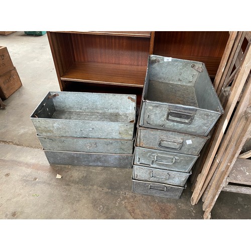 84 - A Lot of eight vintage industrial metal stacking boxes.