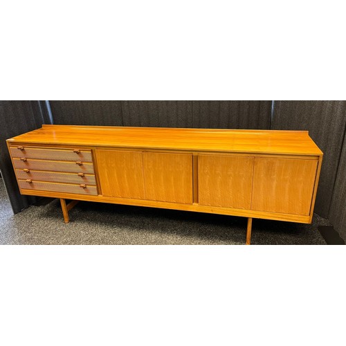 109 - Mid century sideboard with compartments and doors, raised on trestle legs [82x244x46cm]