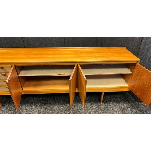 109 - Mid century sideboard with compartments and doors, raised on trestle legs [82x244x46cm]