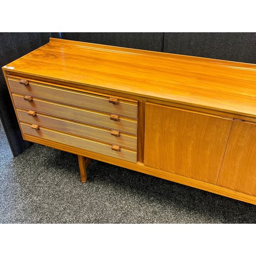 109 - Mid century sideboard with compartments and doors, raised on trestle legs [82x244x46cm]