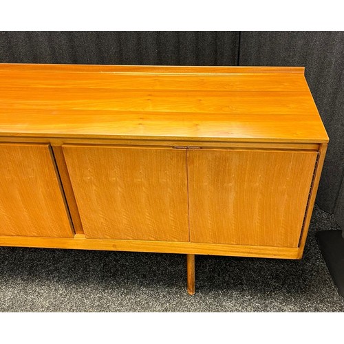 109 - Mid century sideboard with compartments and doors, raised on trestle legs [82x244x46cm]