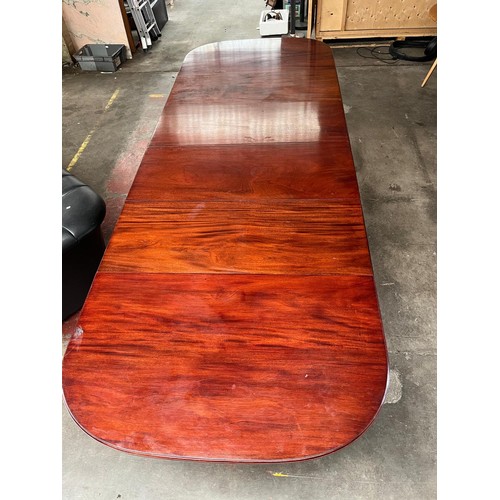 101 - A Large 19th century wind out mahogany dining table, 4 leaves. 11 foot by 4 foot. Has Square tapered... 