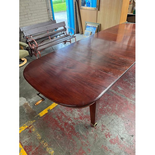 101 - A Large 19th century wind out mahogany dining table, 4 leaves. 11 foot by 4 foot. Has Square tapered... 