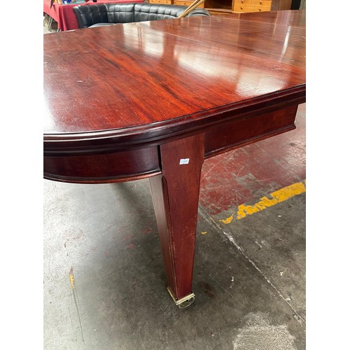 101 - A Large 19th century wind out mahogany dining table, 4 leaves. 11 foot by 4 foot. Has Square tapered... 