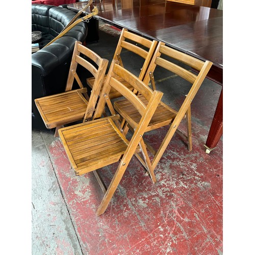 112 - Four folding kitchen chairs, gilt framed mirror and folding cake stand.