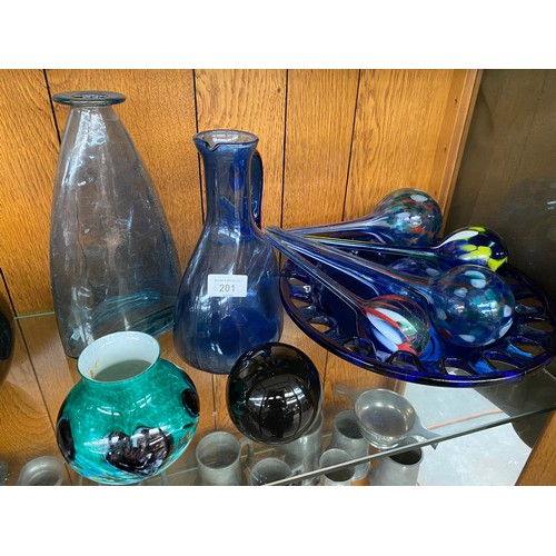 201 - Two shelves of art glass; Bohemian ruby glass bowl, green, black and white vase, Blue glass water ju... 