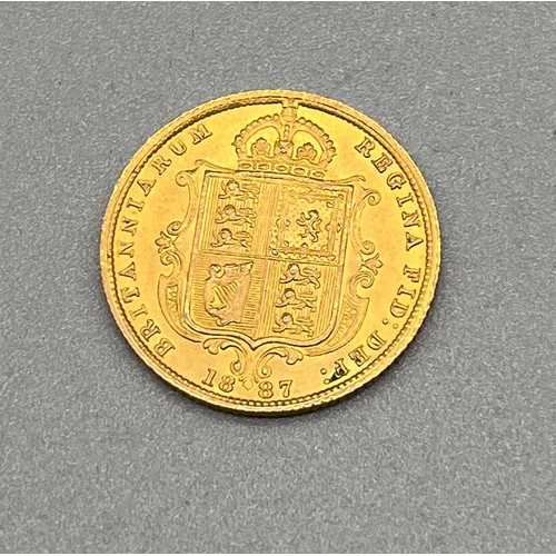 701B - 1887 Queen Victoria gold half sovereign coin.