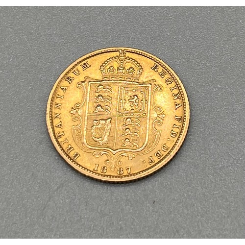 702 - 1887 Queen Victoria gold half sovereign coin.