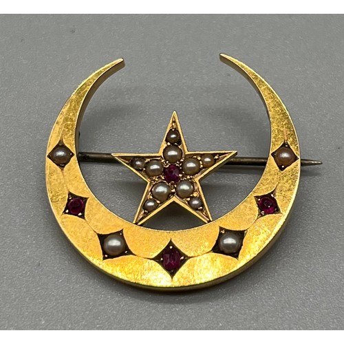 706 - Antique 15ct yellow gold brooch; half crest moon and star, fitted with seed pearls and Ruby stones. ... 