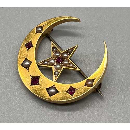 706 - Antique 15ct yellow gold brooch; half crest moon and star, fitted with seed pearls and Ruby stones. ... 