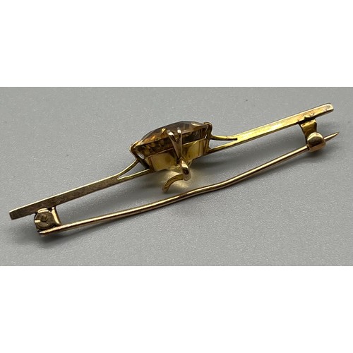 707 - Antique 9ct yellow gold bar brooch; fitted with a large smokey quarts stone [14.3mm- stone] [5.49gra... 