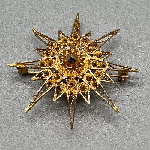 709 - High grade foreign gold star style pendant/ brooch. [Tested positive for 18ct-24ct gold] [7.95grams]