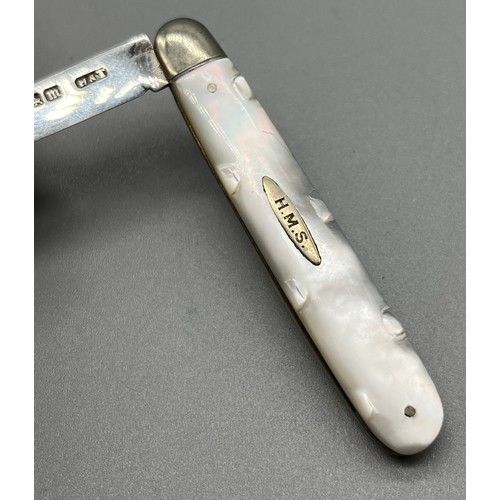 18 - Sheffield silver and mother of pearl fruit knife. Fitted with a silver cartouche with initials H.M.S... 