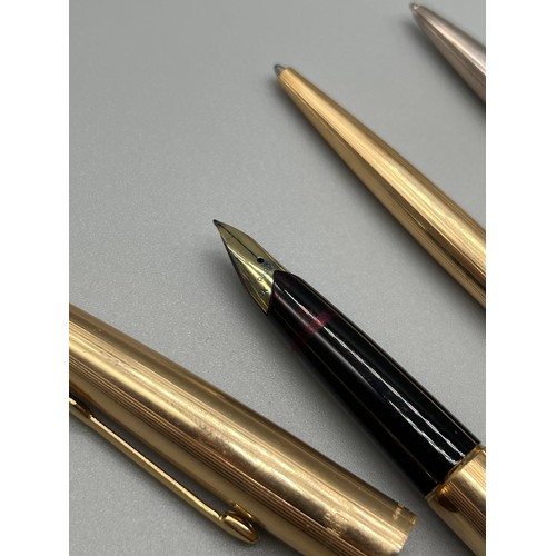 22 - Three vintage pens; Parker 61, RG ball point pen and Parker 65 fountain pen with 14ct gold nib and a... 