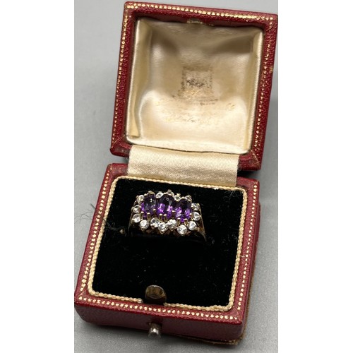 725 - Ladies 9ct yellow gold ring; set with three oval cut amethysts surrounded by white gem stone cluster... 