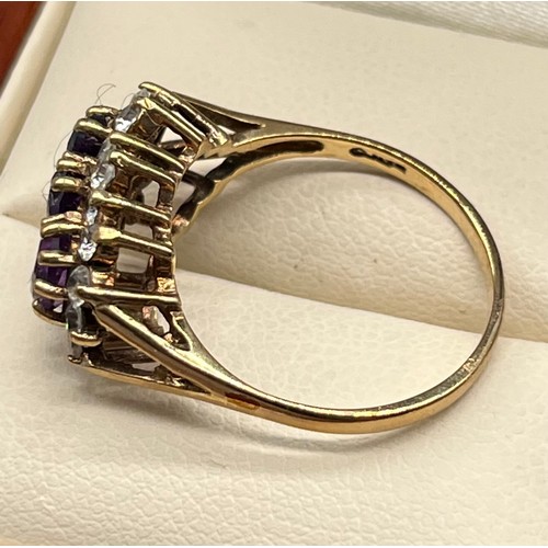 725 - Ladies 9ct yellow gold ring; set with three oval cut amethysts surrounded by white gem stone cluster... 