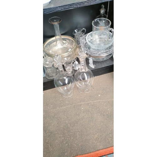 436 - A Shelf of glass and crystal; Steuben glass bowl with box, Two Edwardian decanters with stoppers.