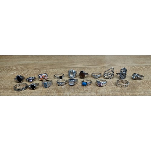 52 - A Collection of 18 various silver rings with some gem stones fitted.