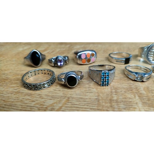 52 - A Collection of 18 various silver rings with some gem stones fitted.