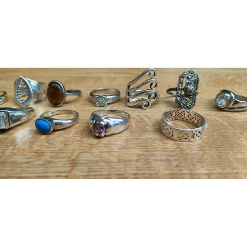 52 - A Collection of 18 various silver rings with some gem stones fitted.